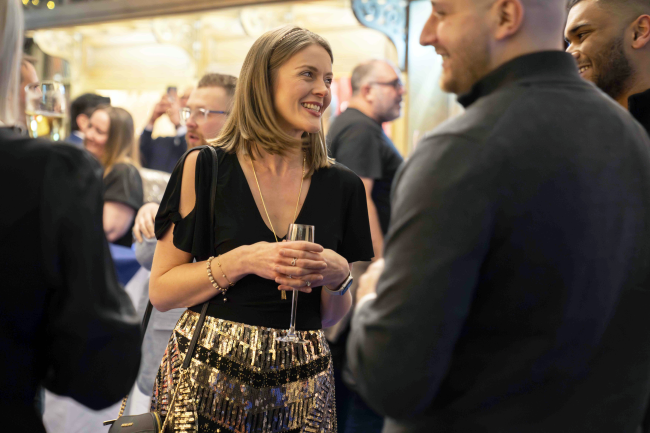 People smiling and chatting